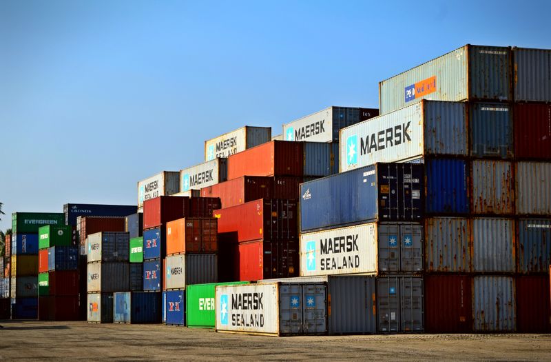 Cargo container terminal with cranes and logistics lanes
